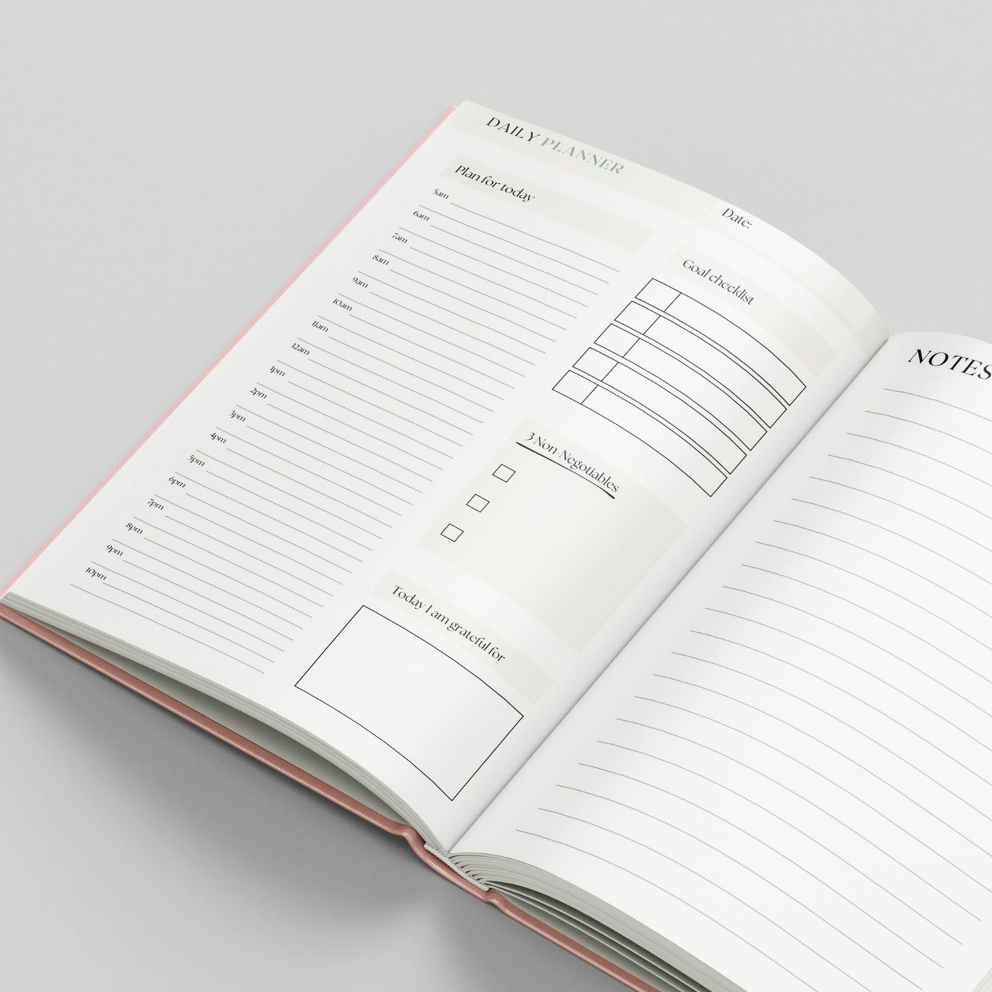 An open daily planner notebook showing lined pages with sections for a daily planner, notes, and a to-do list, photographed on a light gray background.
