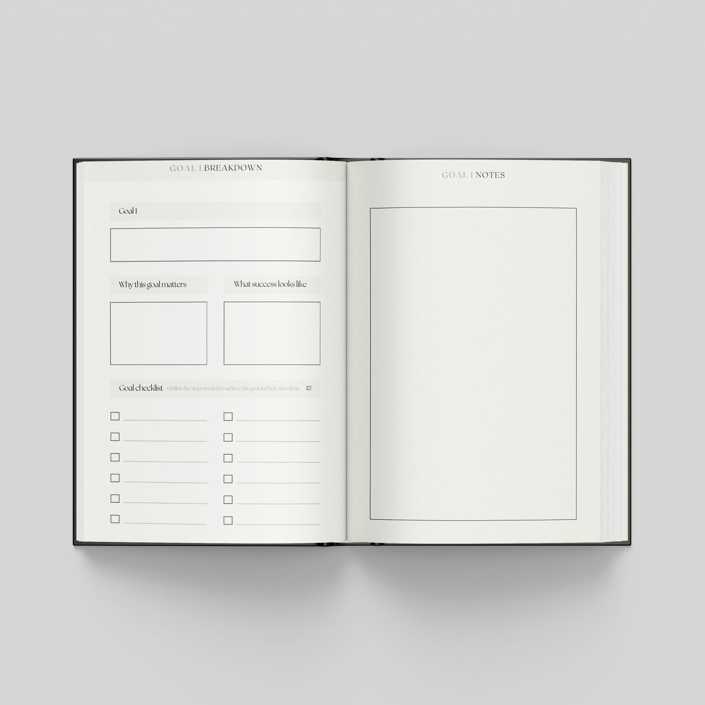 Productivity planner opened to goal planning pages featuring a structured goal framework, progress checklist and notes page for planning.