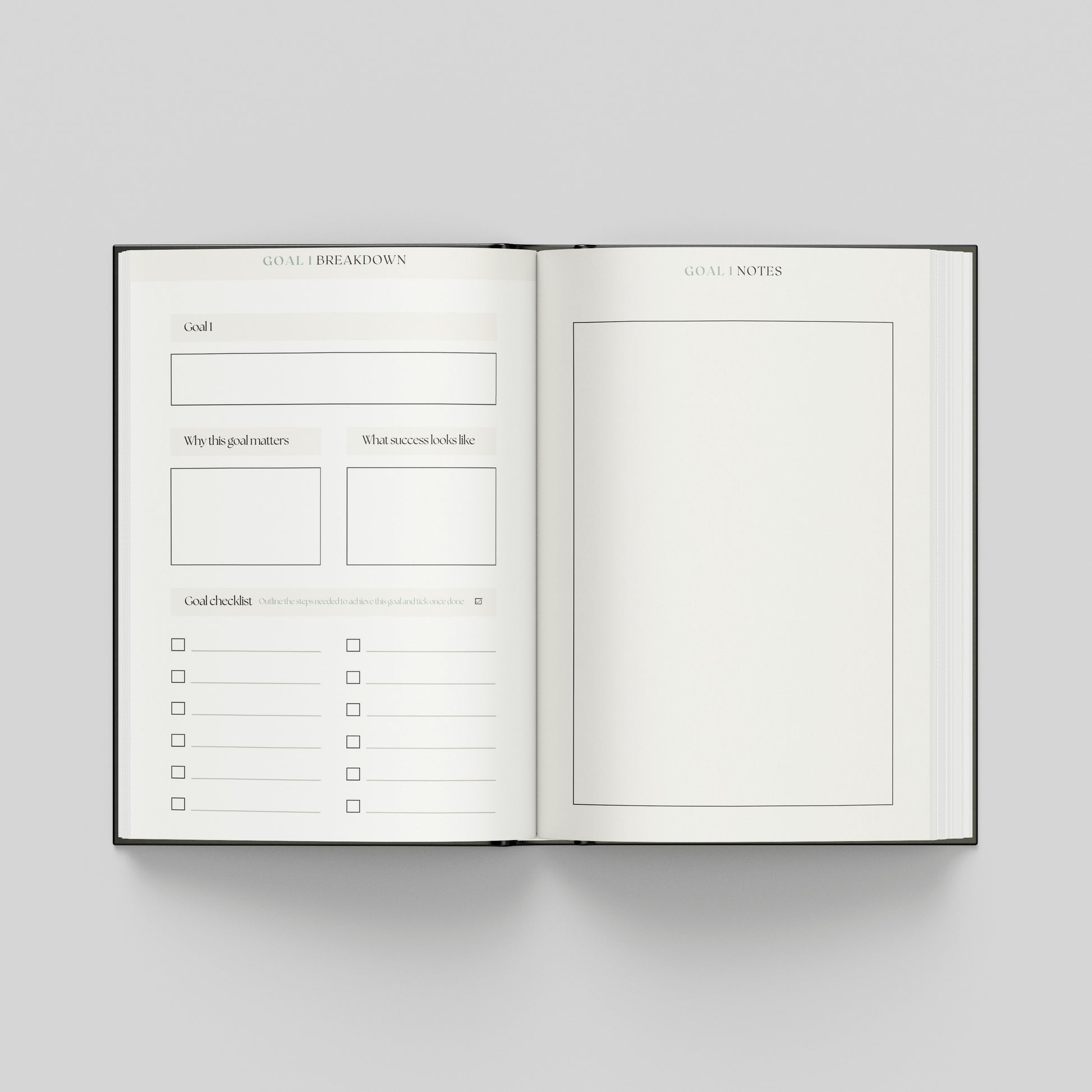 Productivity planner opened to goal planning pages featuring a structured goal framework, progress checklist and notes page for planning.
