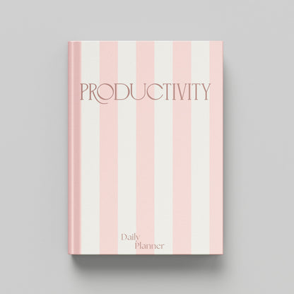 A hardcover daily planner with a pink and off-white vertical striped cover, featuring the word 'PRODUCTIVITY' in a dark pink serif font and 'Daily Planner' at the bottom, shown on a neutral grey background.
