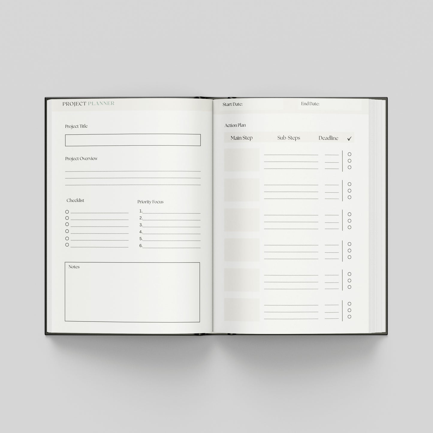 An open hardcover project planner book displayed flat against a neutral light grey background. The pages are white with black printed text and lines for tracking project details, milestones, and tasks.