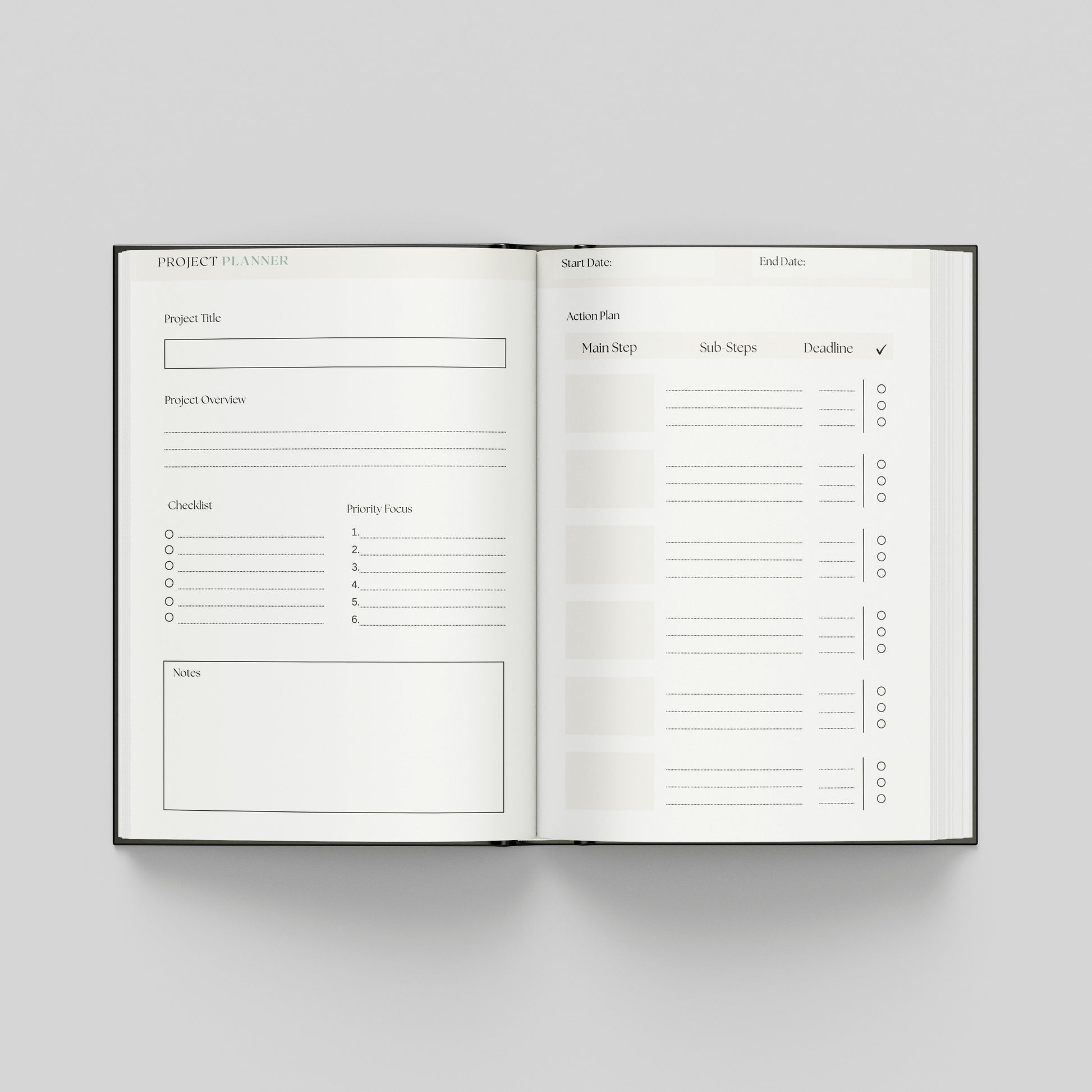 An open hardcover project planner book displayed flat against a neutral light grey background. The pages are white with black printed text and lines for tracking project details, milestones, and tasks.