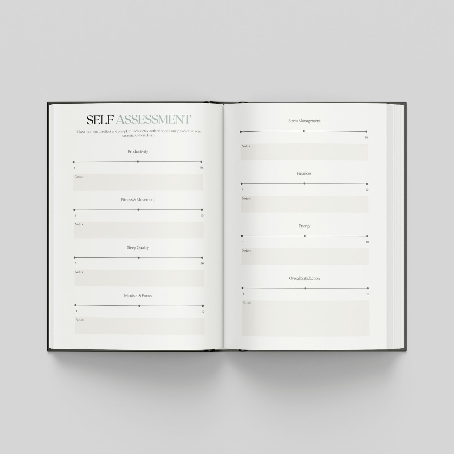 An open hardcover book showing two white pages with a self-assessment template layout, photographed from above on a light grey background.
