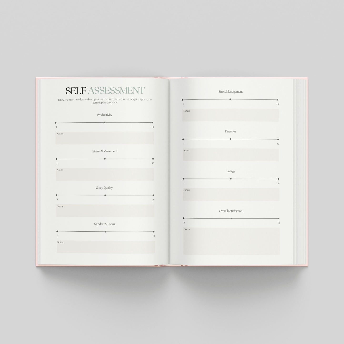 An open hardcover journal or planner on a light grey background, showing two white pages with printed self-assessment review sections to see where you are now to look back on in the future.