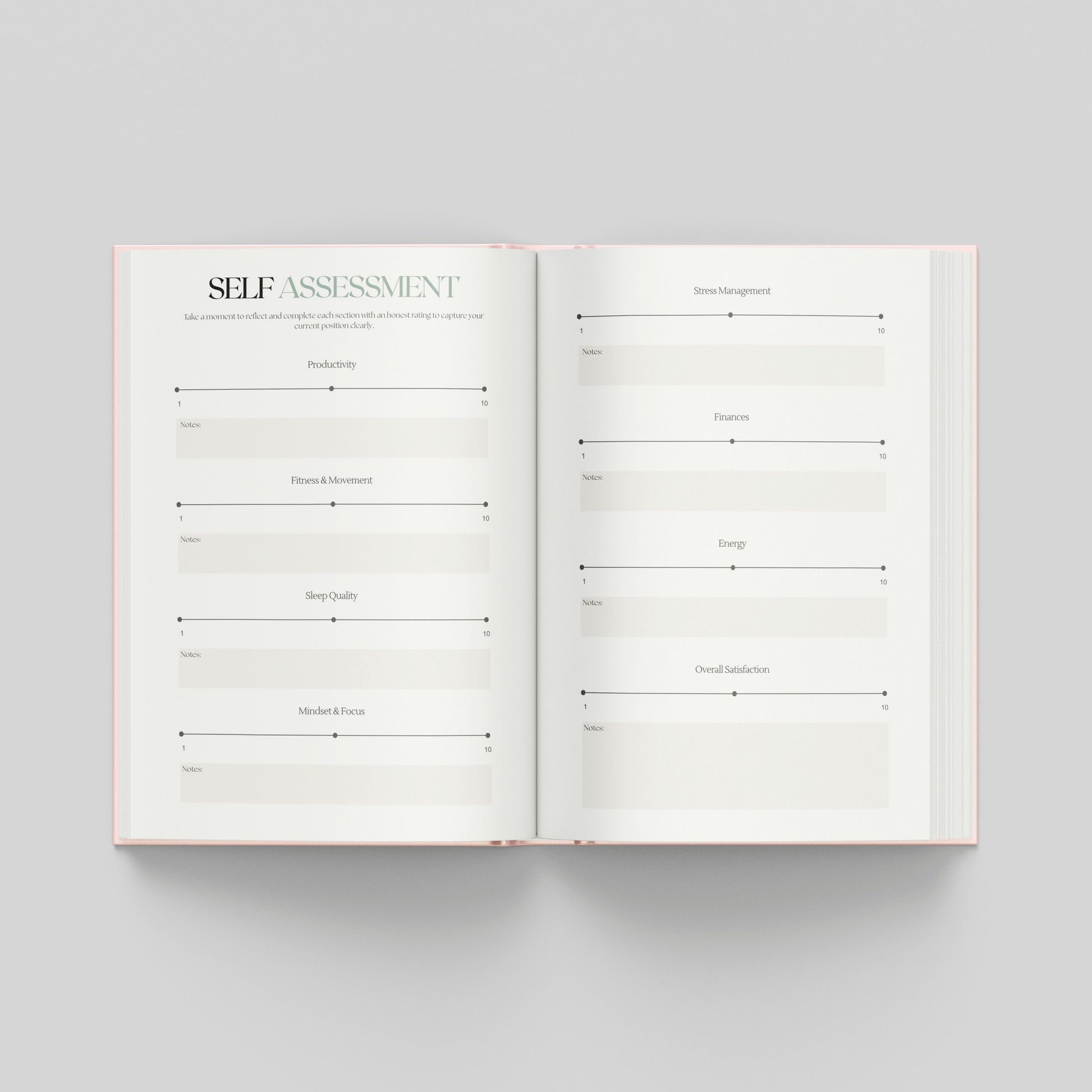 An open hardcover journal or planner on a light grey background, showing two white pages with printed self-assessment review sections to see where you are now to look back on in the future.